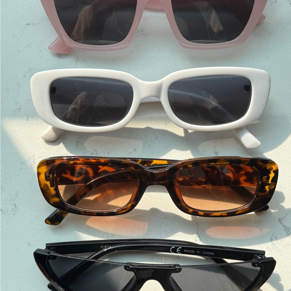 Four Pairs of Plastic Sunglasses